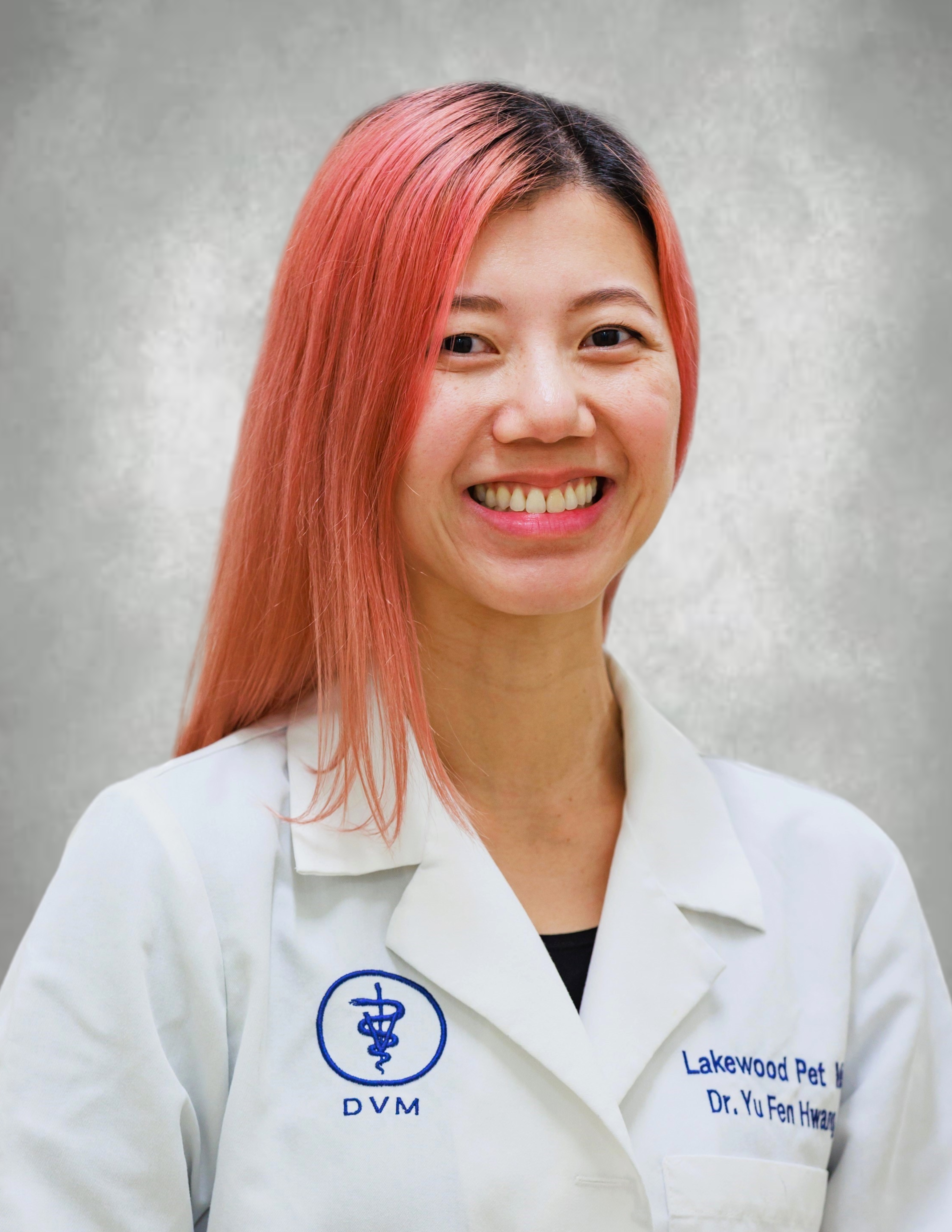 Dr. Jen smiling in her lab coat